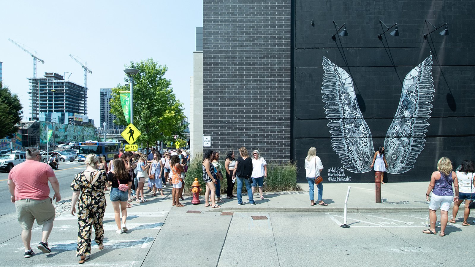 People walking through The Gulch neighborhood of Nashville.