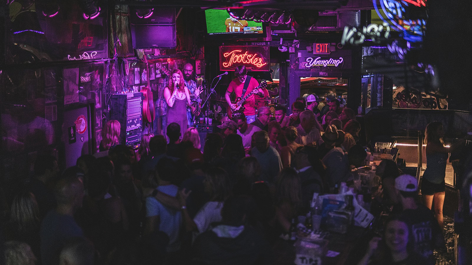 A band performing to a full crowd inside Tootsies in Nashville.