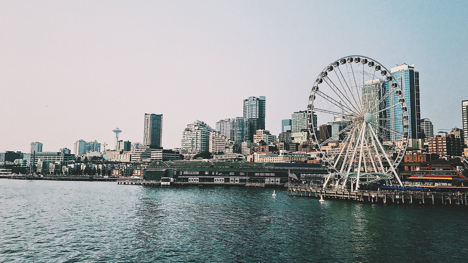 A few of the Seattle skyline from the Puget Sound with The Seattle Great Wheel on the right.