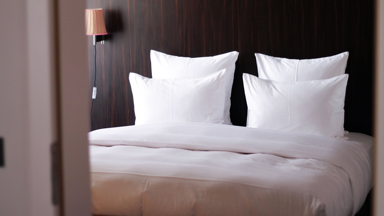 An image of a hotel bed in Seattle.
