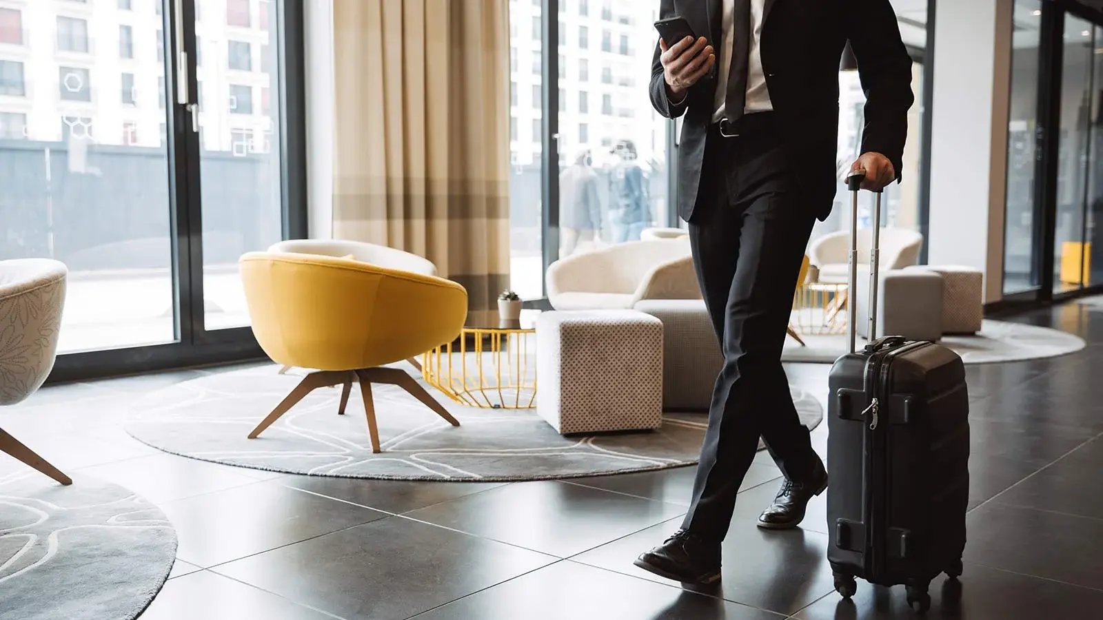 A person walking through a hotel lobby