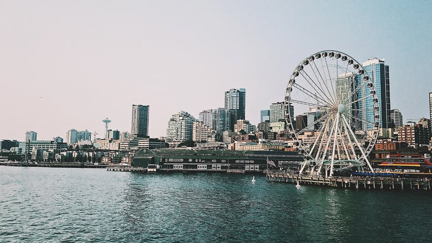 A view of the Seattle skyline from the Puget Sound with The Seattle Great Wheel on the right.