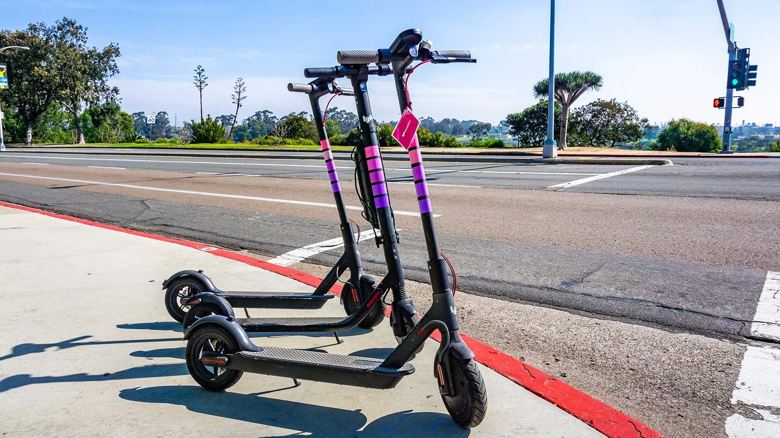 Electric scooters parked on a sidewalk