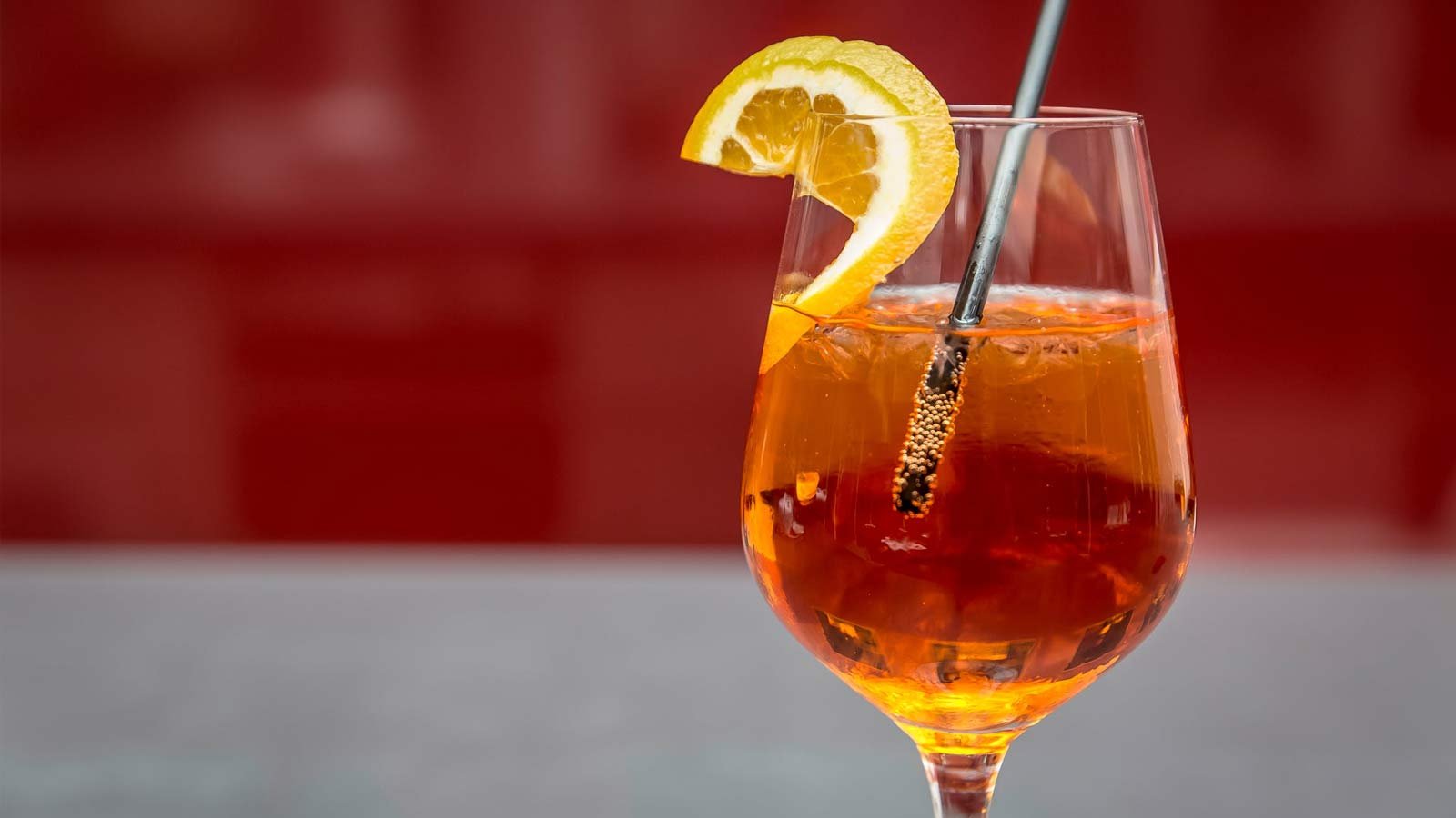 Cocktail in glass with orange garnish
