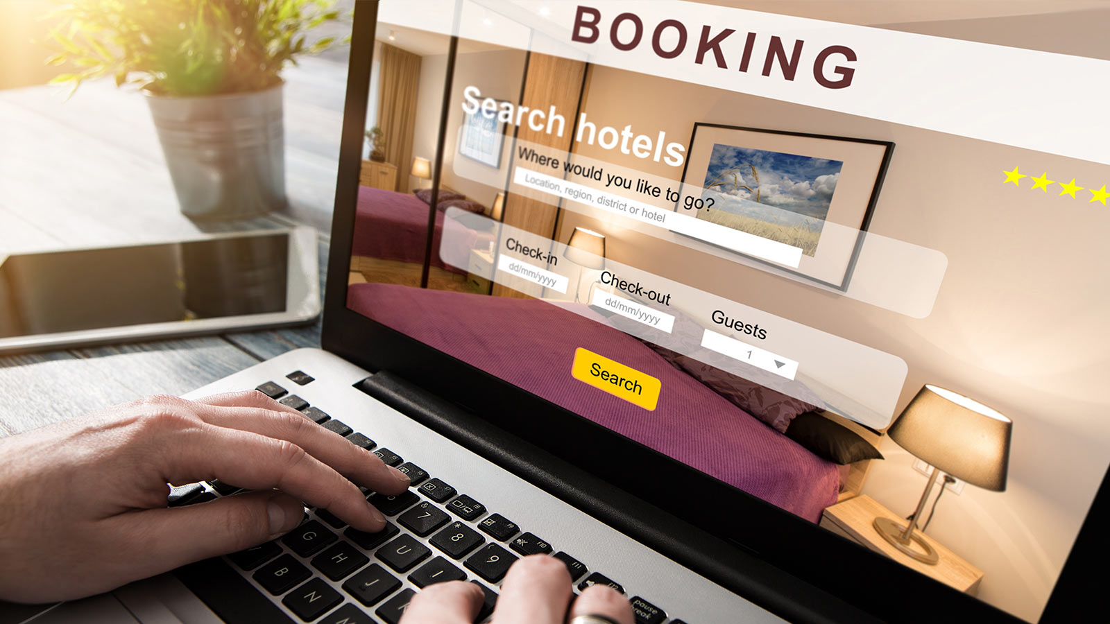 Booking hotel on laptop